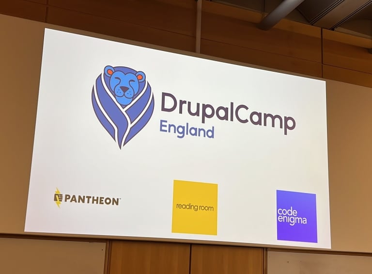 The opening slide for DrupalCamp England's opening session, showing logos for the event and main sponsors.